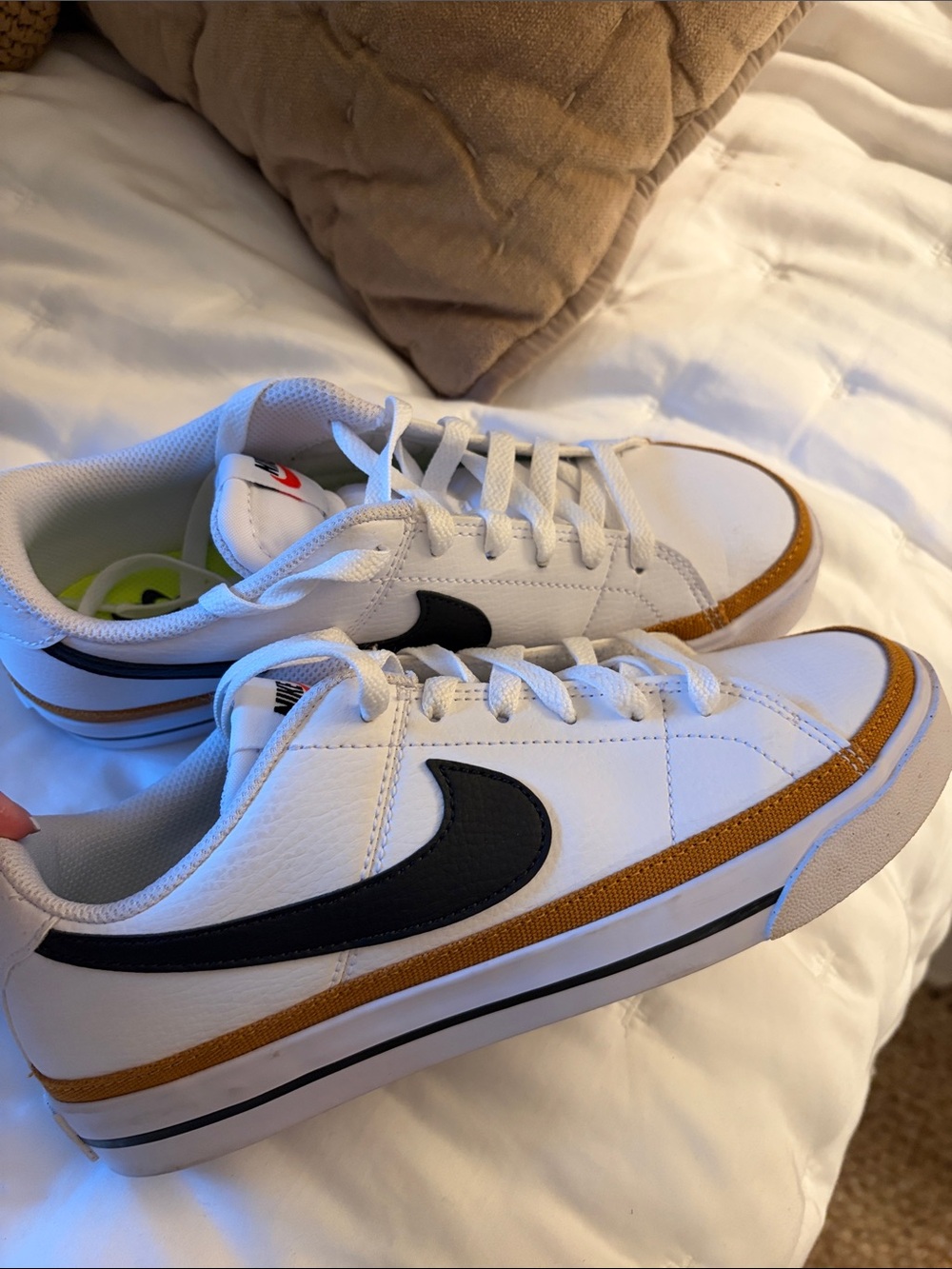 Nike Kids White Sneakers with Black Swoosh and Brown Accent